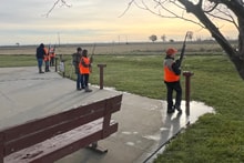 Youth hunters practicing at an outdoor shooting station in the rain